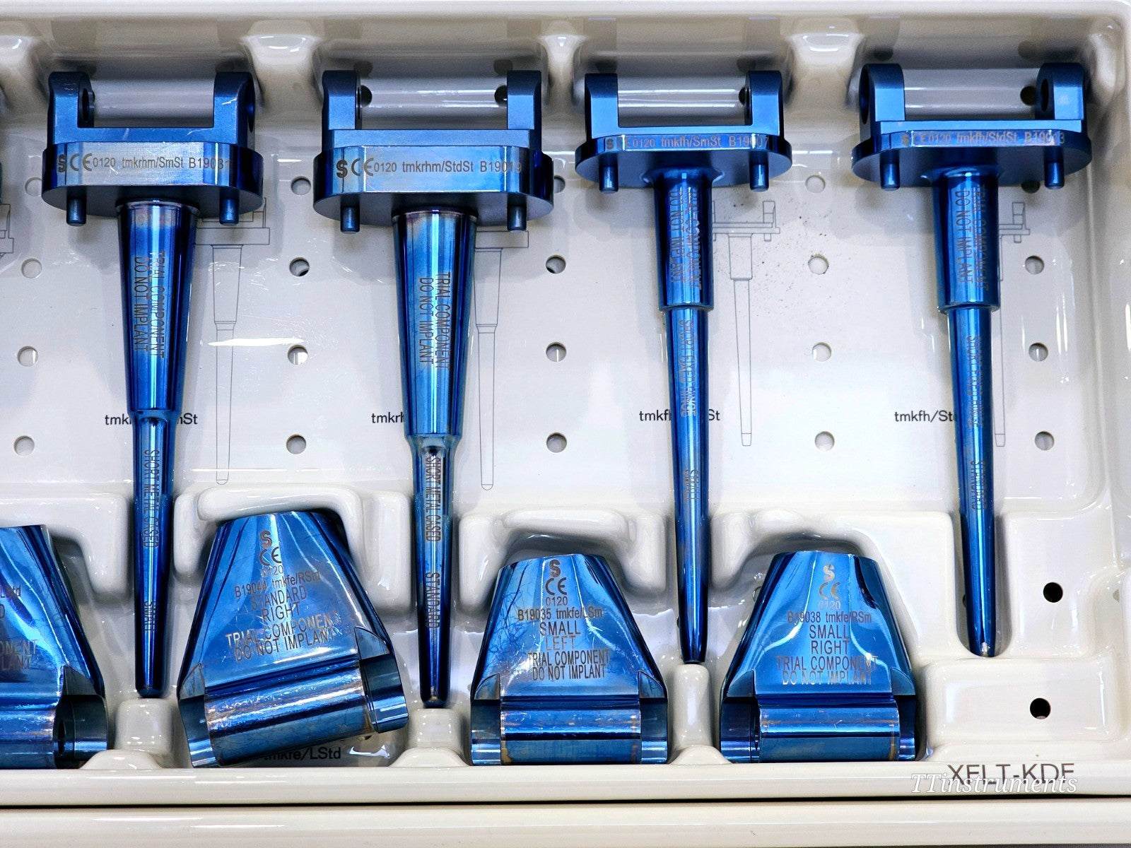 Stanmore METS upper tray close-up showing four short-stem trial handles and Standard Right, Small Left, Small Right femoral bodies