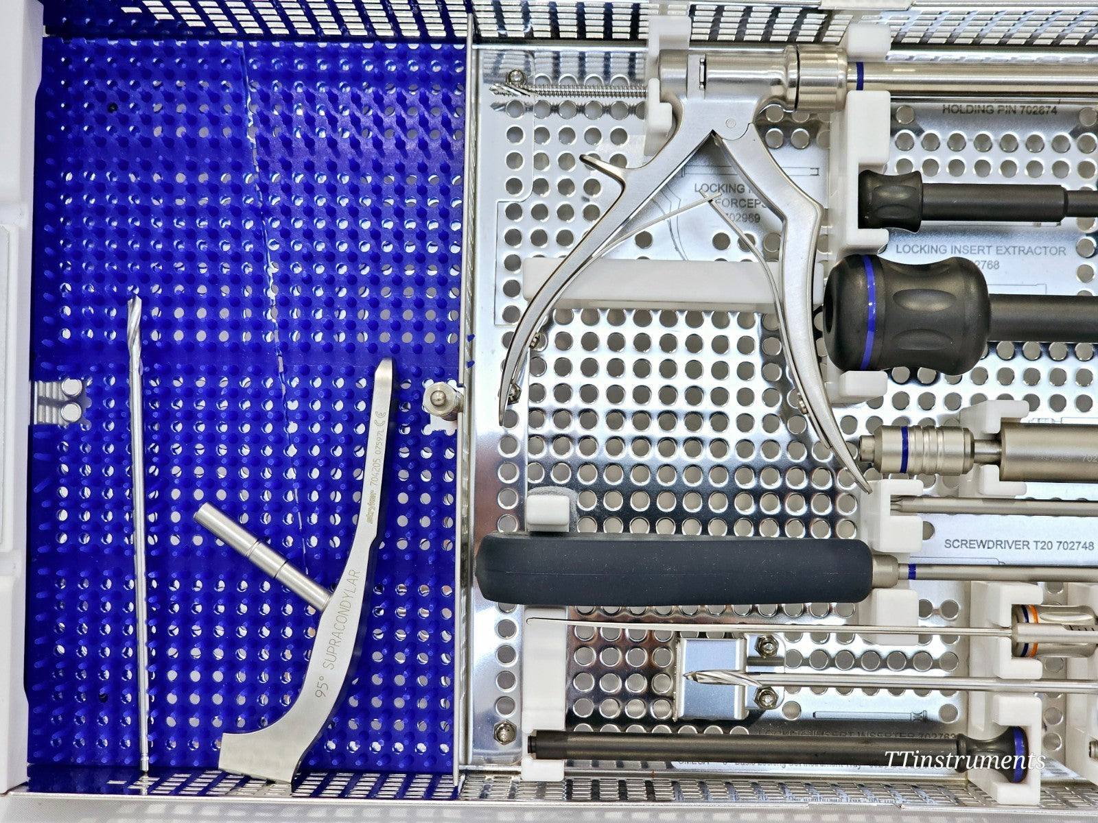 Stryker Omega 3 tray close-up showing 95° supracondylar guide, locking insert forceps 702969, medium T-handle and screwdriver