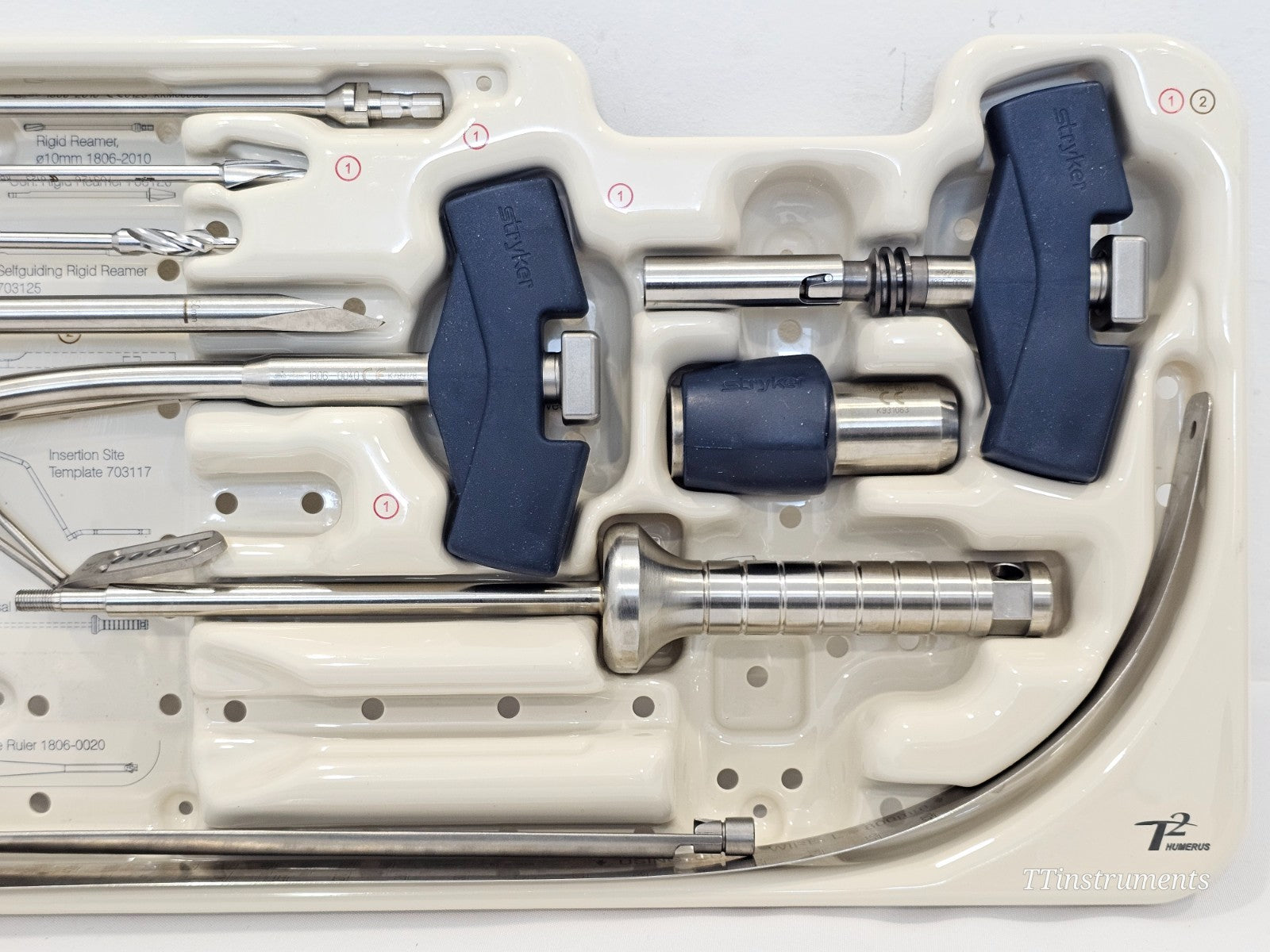 Stryker T2 Humerus Tray 1 close-up — rigid reamer 1806-2010, selfguiding rigid reamer 703125, insertion site template 703117, T-handles and universal insertion handle