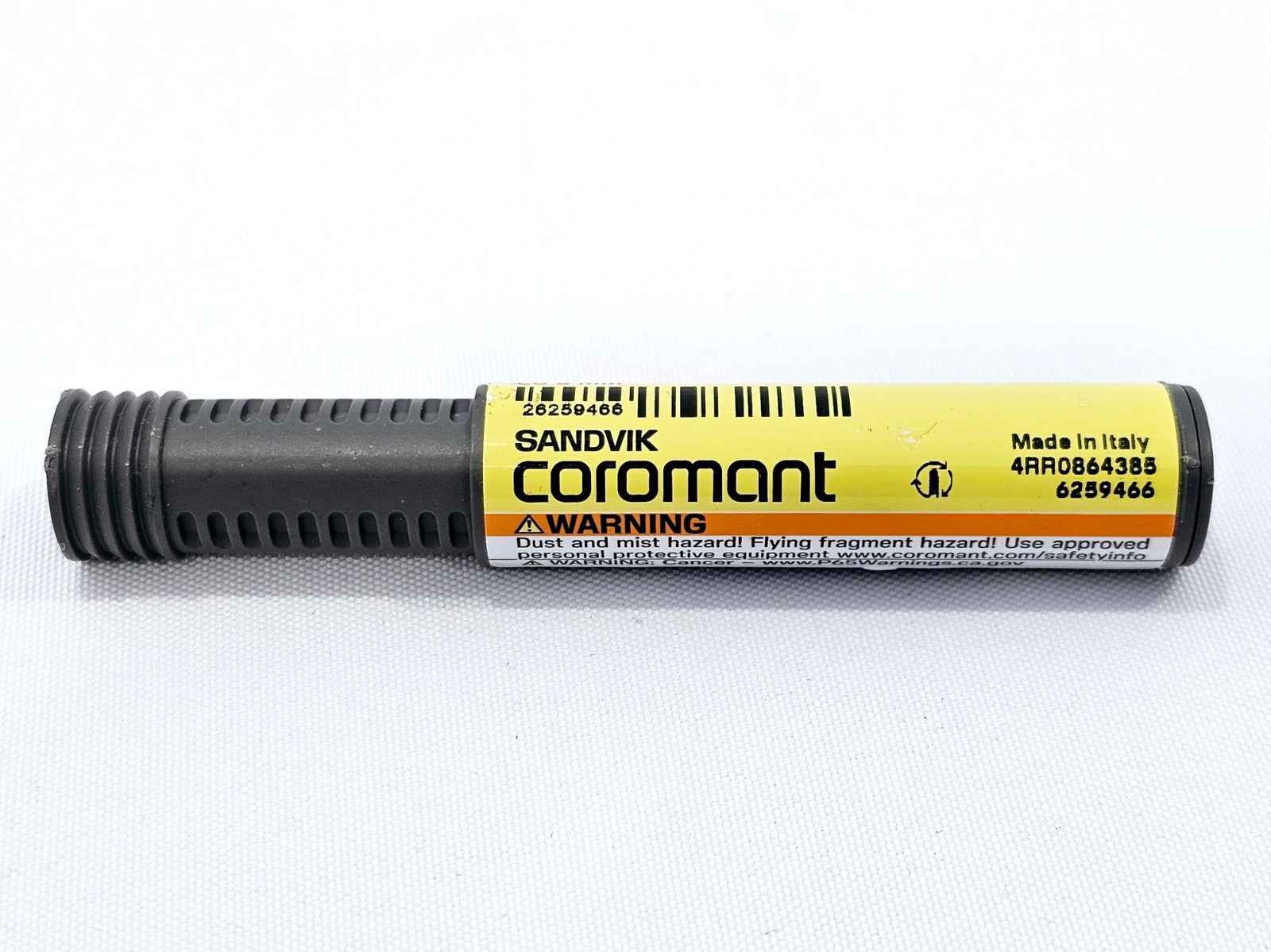 Sandvik Coromant CoroMill Dura 1B240-0300-XA protective storage tube showing yellow label and warning text