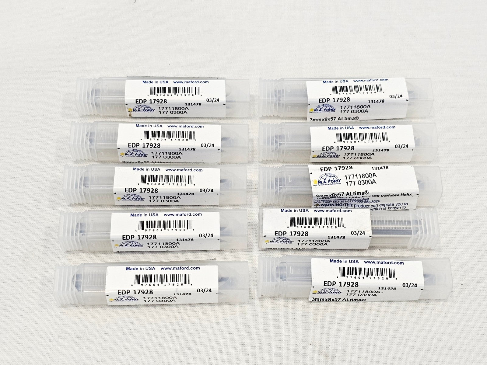 10x M.A. Ford TuffCut XR 17711800A 3mm end mills in clear plastic tubes, overhead view