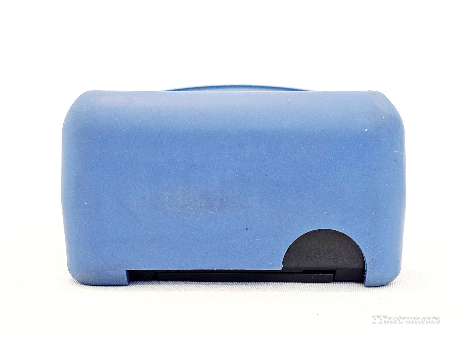 EXFO FOT-922 MaxTester bottom view showing battery compartment door and blue rubber boot base