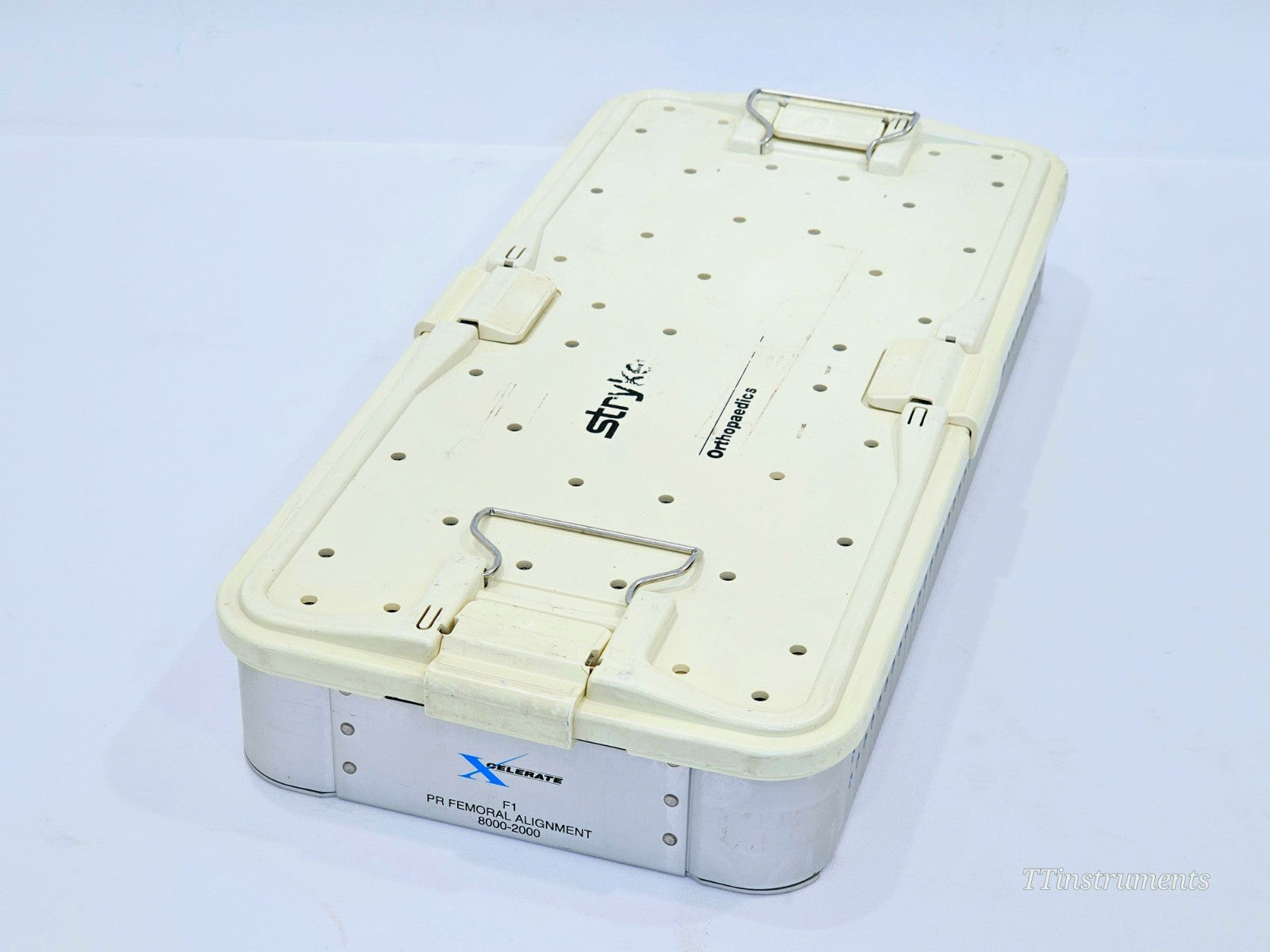 Stryker XCELARATE F1 PR Femoral Alignment sterilisation case closed showing ref 8000-2000 label, Stryker Orthopaedics branding and wire latches