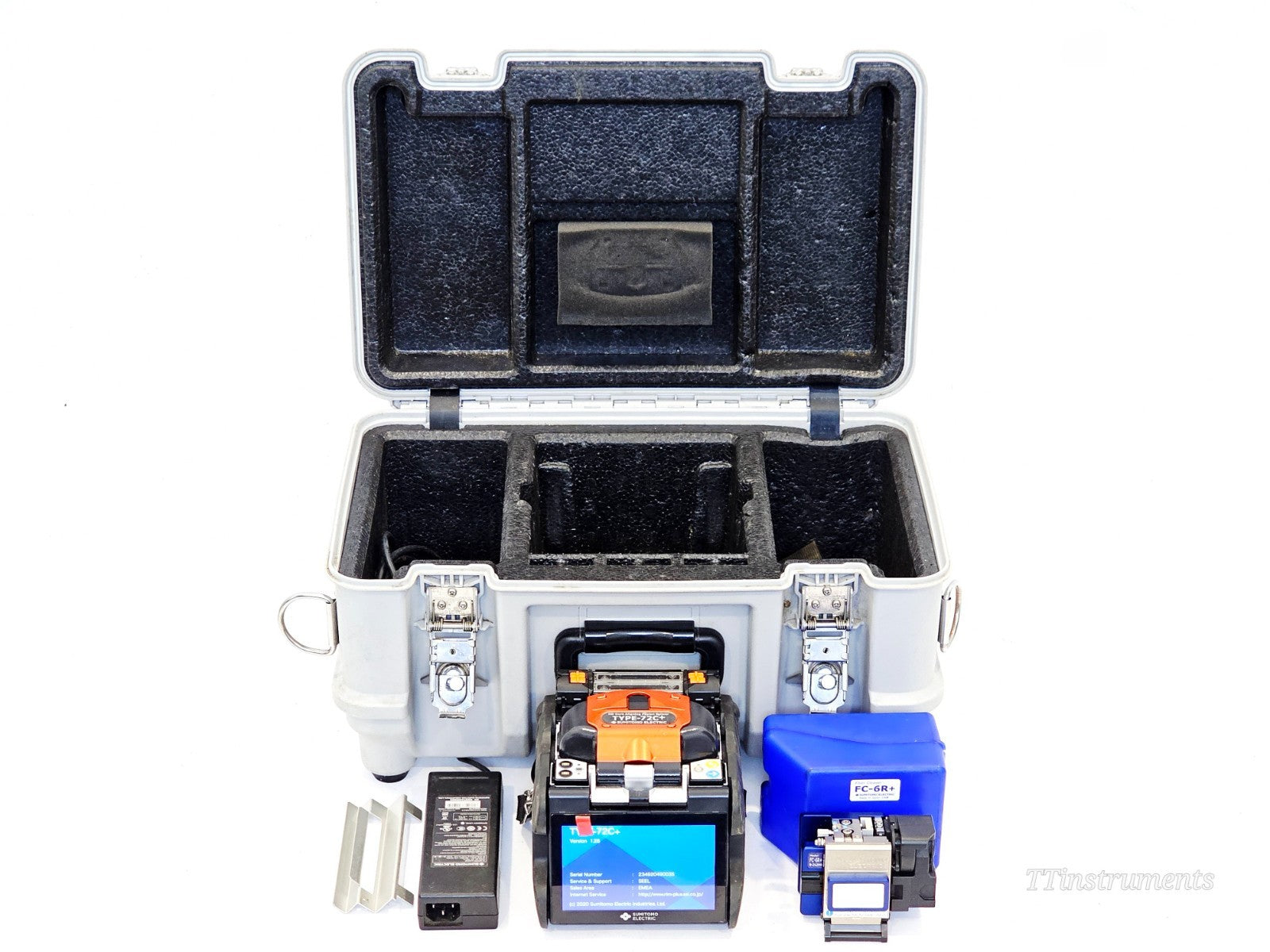 Sumitomo TYPE-72C+ fusion splicer kit laid out with FC-6R+ cleaver, AC adapter, and open hard carry case