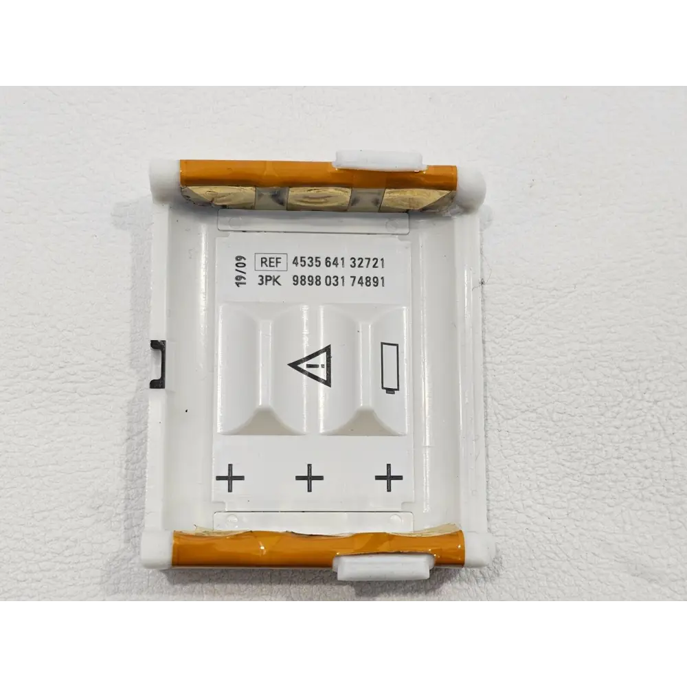 Philips IntelliVue MX40 AA battery holder tray REF 453564132721 showing contact pins and label dated 19/09