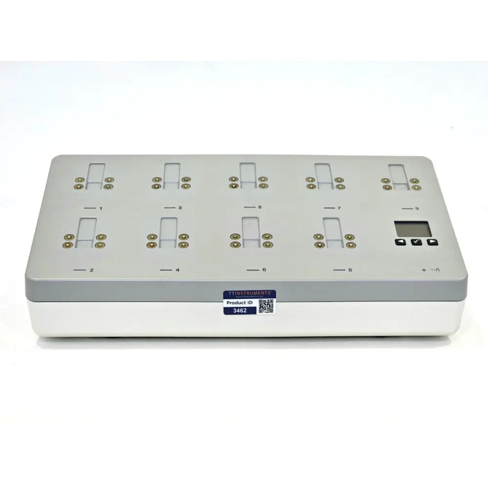 Philips IntelliVue 865220 9-bay battery charging station top view showing numbered docking contacts and LCD display