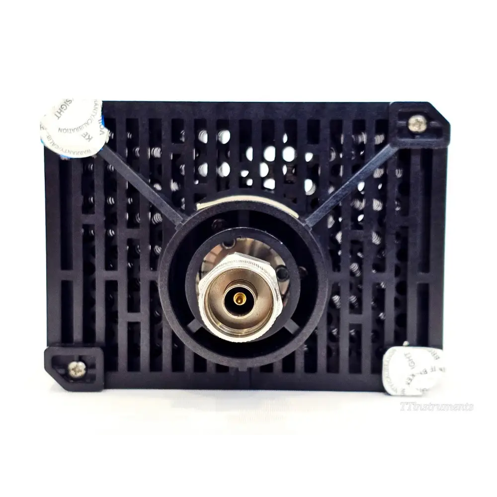 Agilent 8498A 30dB attenuator opposite end showing vented panel, connector and calibration warranty seals