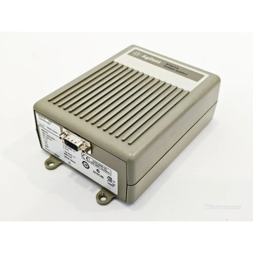 Agilent 87421A Power Supply angled view showing D-Sub output port and rear specification label with I/O ratings