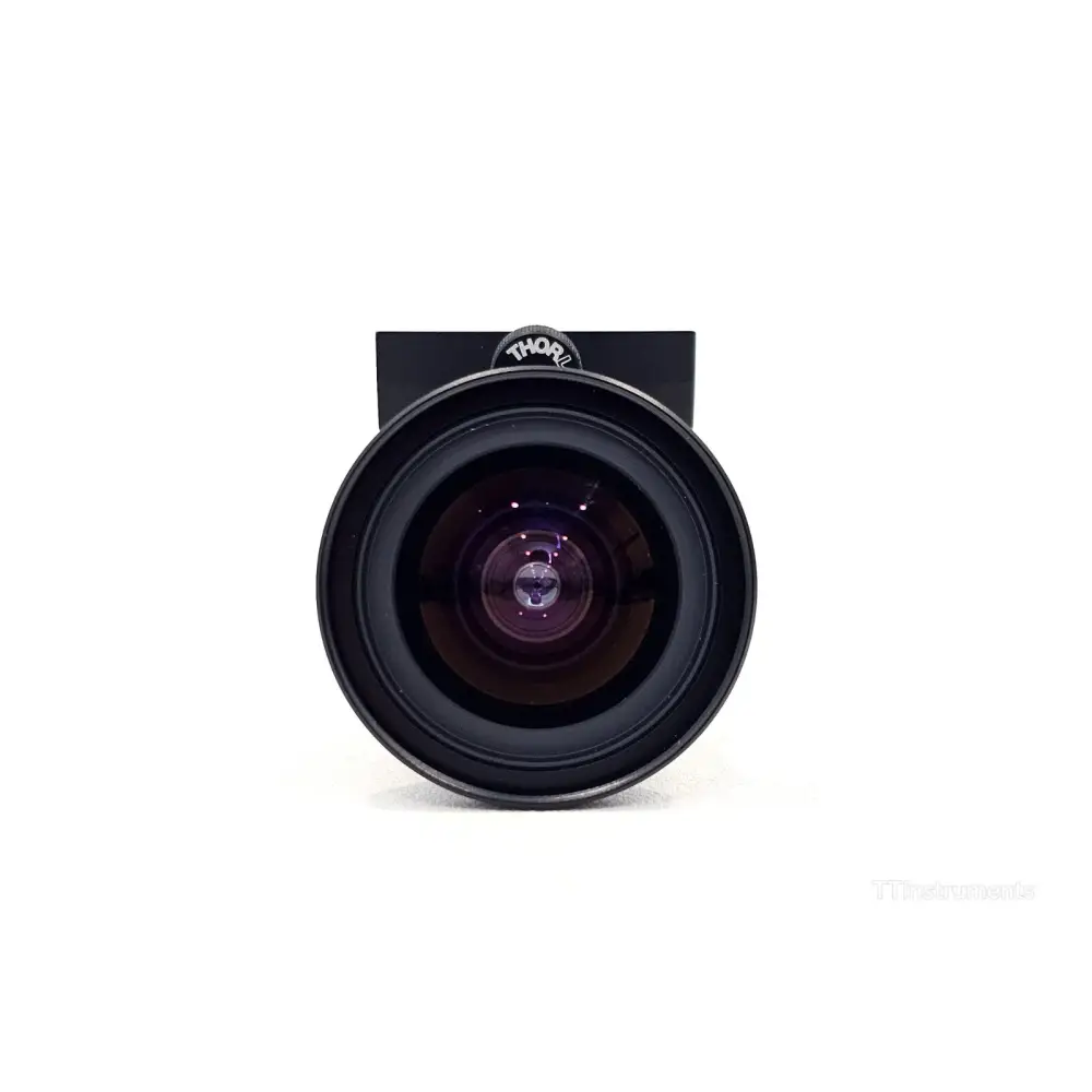 Kowa LM8HC 8mm f/1.4 C-Mount lens front element close-up view showing anti-reflection coated glass
