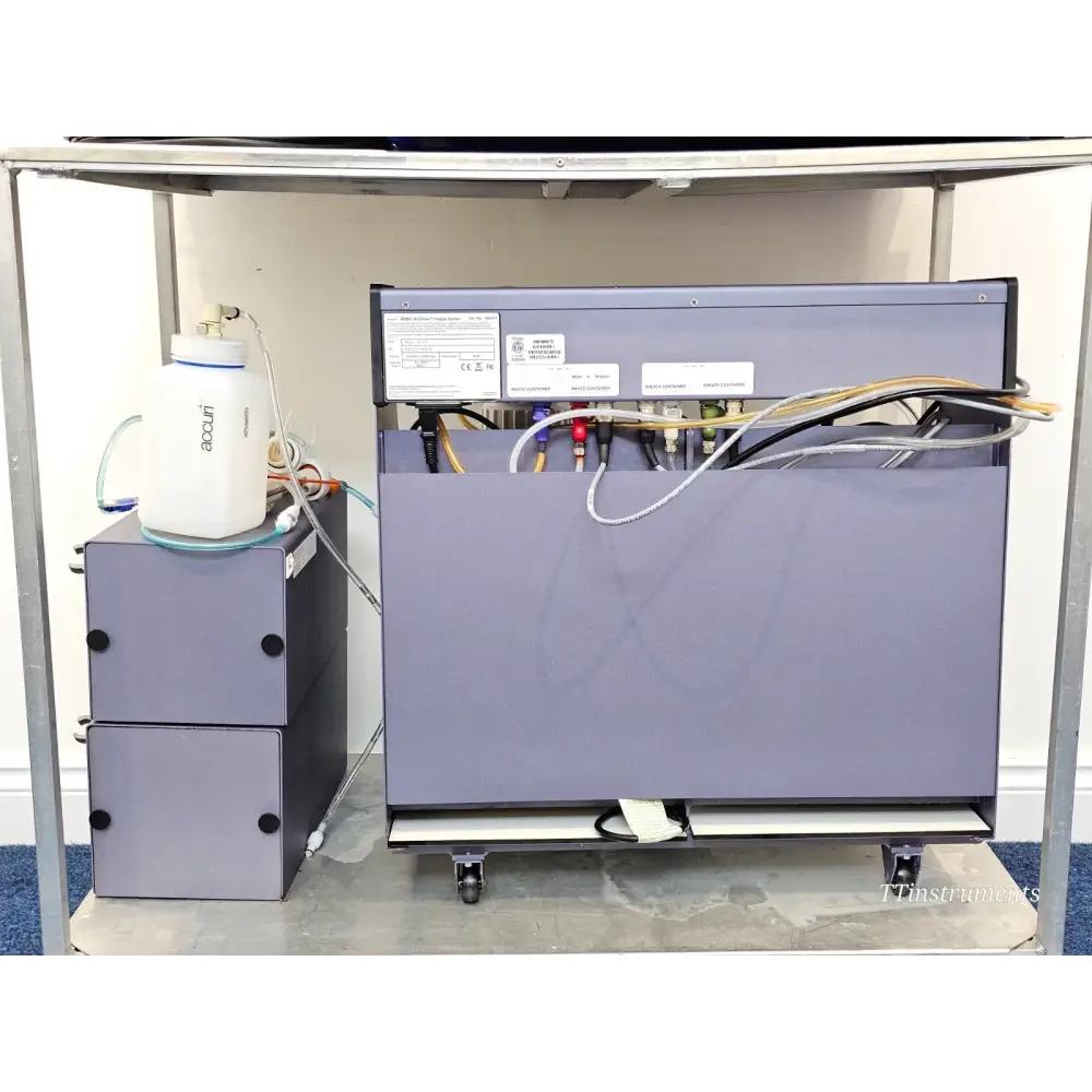 BD FACSCelesta FACSFlow Supply System rear view showing sheath and waste container ports, Accuri waste bottle on cart