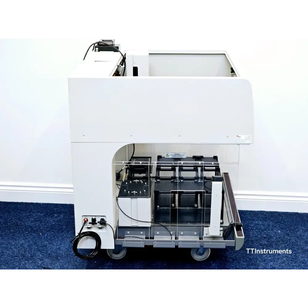 Biomek NXP multichannel pipetting head close-up showing tip channels and gripper assembly