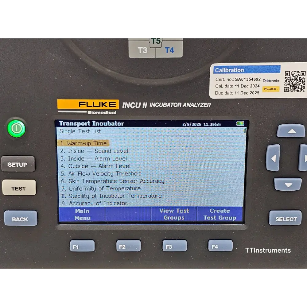 Fluke INCU II analyzer showing Pass/Fail test result screen on LCD