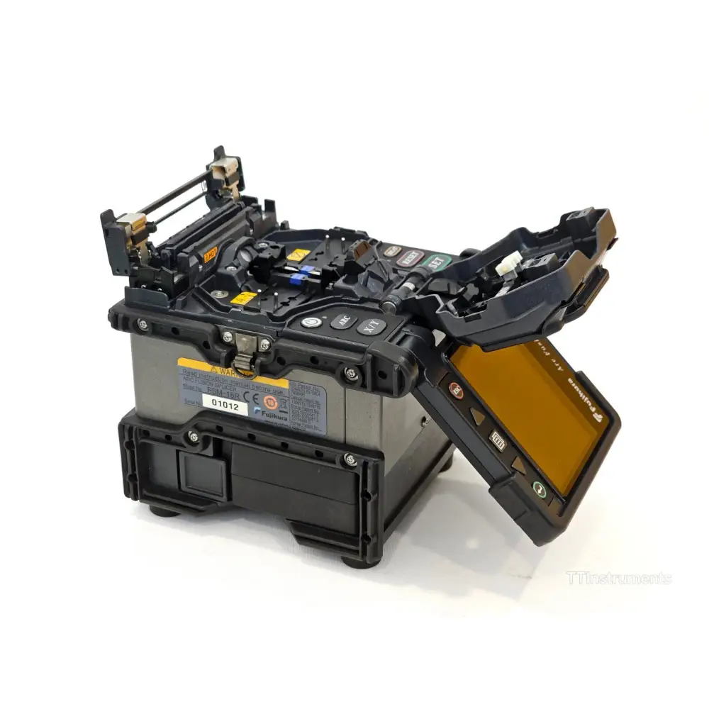Fujikura FSM-18R splicer showing monitor in rear-facing position with fibre loaded ready for splicing