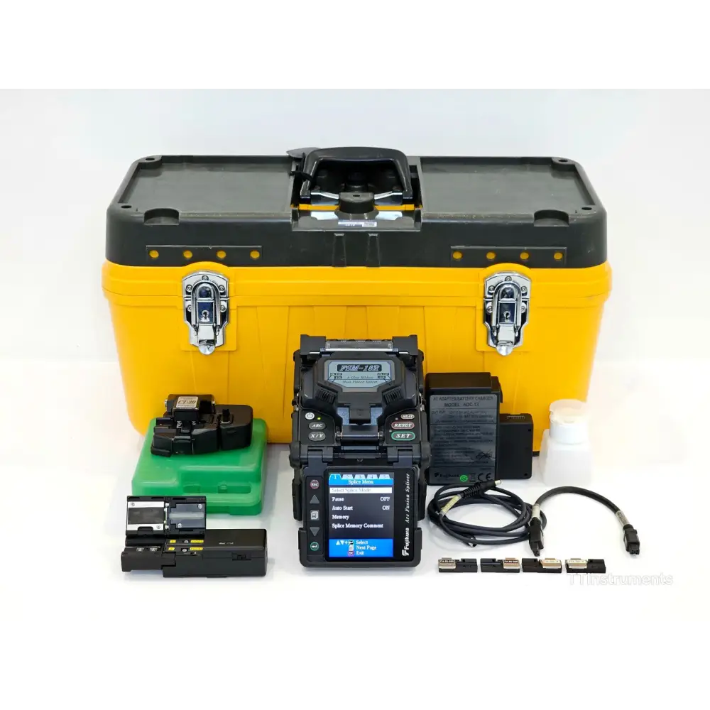 Fujikura FSM-18R ribbon fusion splicer front view showing dual-position colour LCD monitor and wind protector