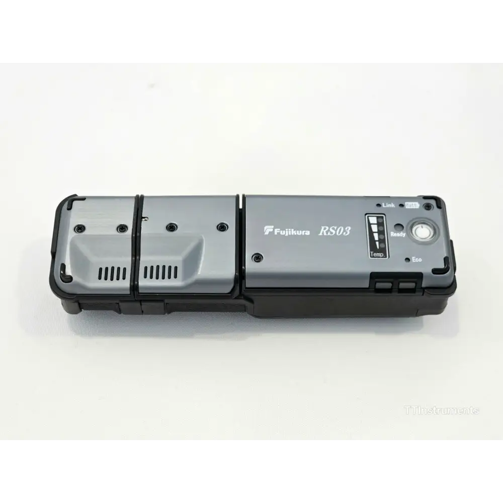 Fujikura FSM-70R ribbon splicer stored inside hard carrying case with work tray