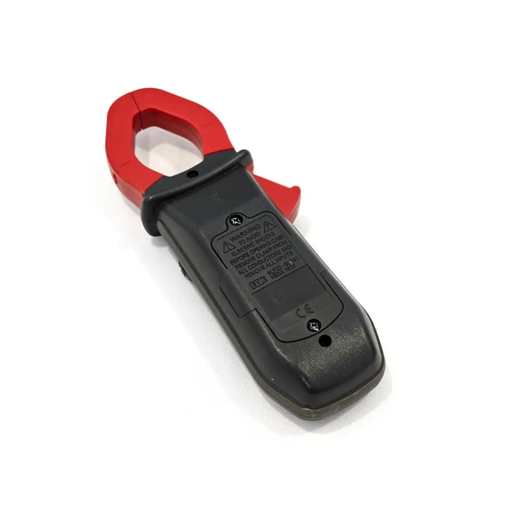 Chauvin Arnoux F203 clamp meter rear view showing battery compartment, CE marking, and safety warning labels