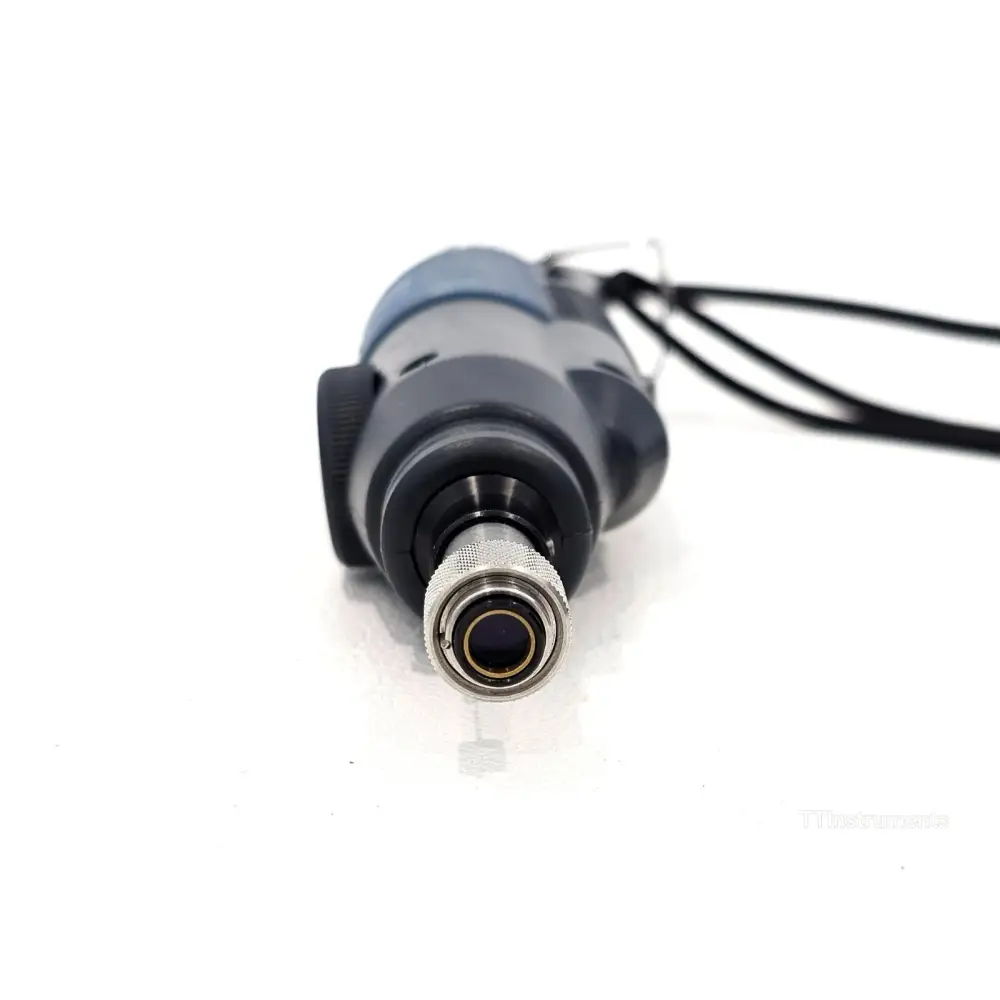 EXFO FIP-400 fibre probe front-end close-up showing knurled metal lens barrel and optical aperture