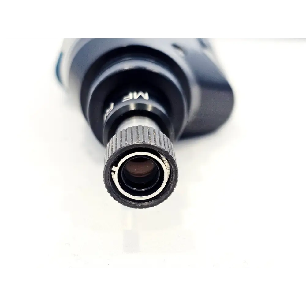 Close-up of EXFO FIP-430B probe tip end showing MF Ready optical lens and knurled metal connector interface