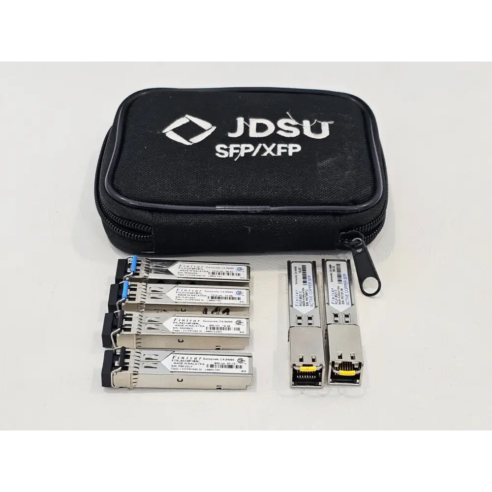Mixed lot of Finisar Copper, 850nm, and 1310nm SFP transceivers laid out together