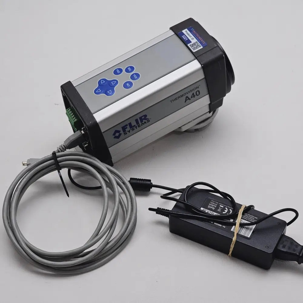 FLIR Thermovision A40 infrared imager angled top view with TT Instruments product ID label 3221 and power adapter