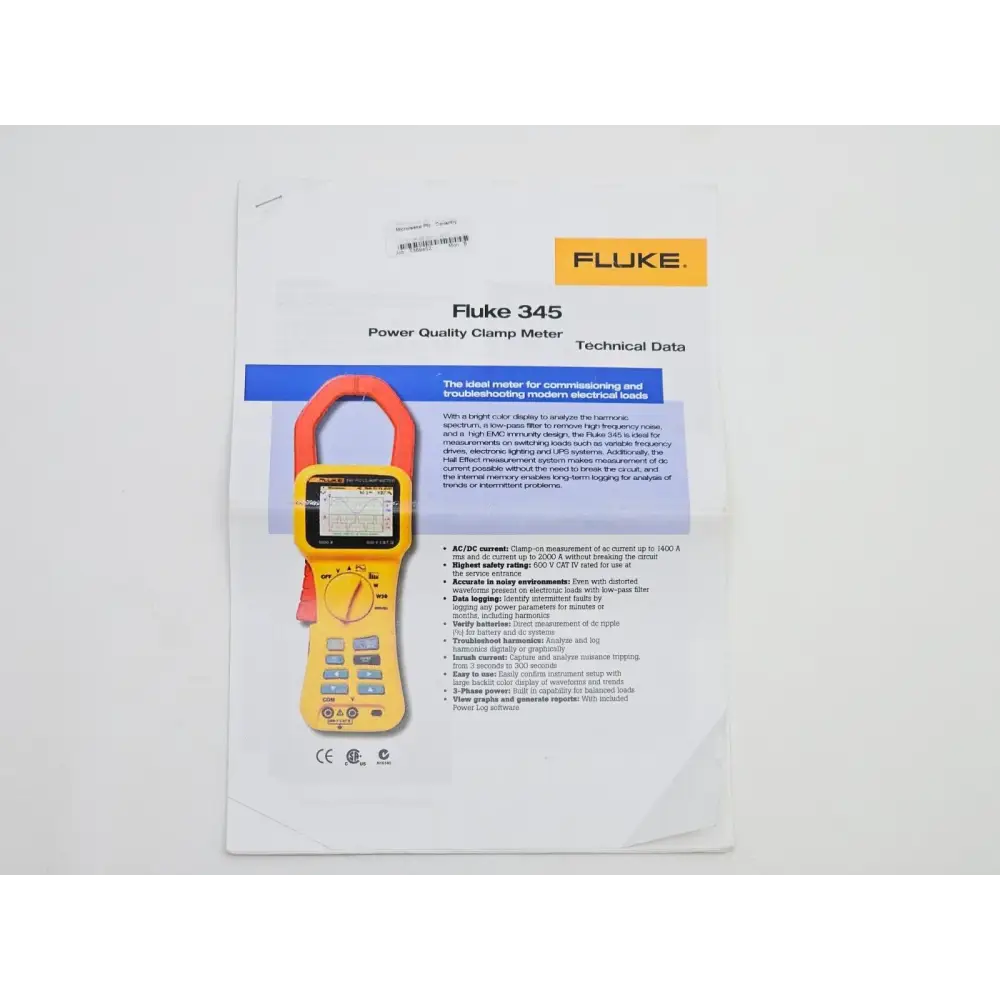 Fluke 345 clamp meter and accessories laid out including leads and carry case
