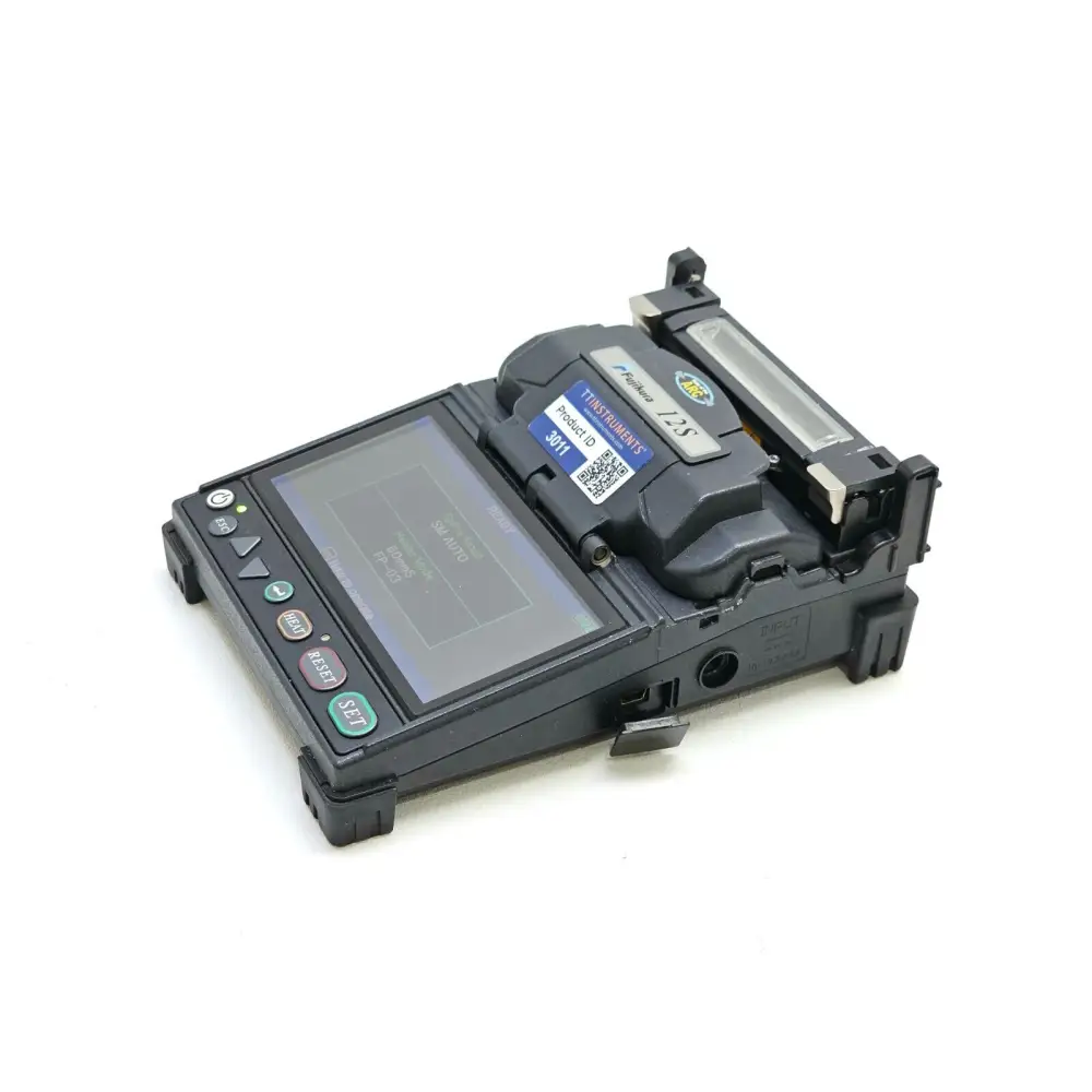 Fujikura 12S splicer top-down view showing wind protector and splicing chamber