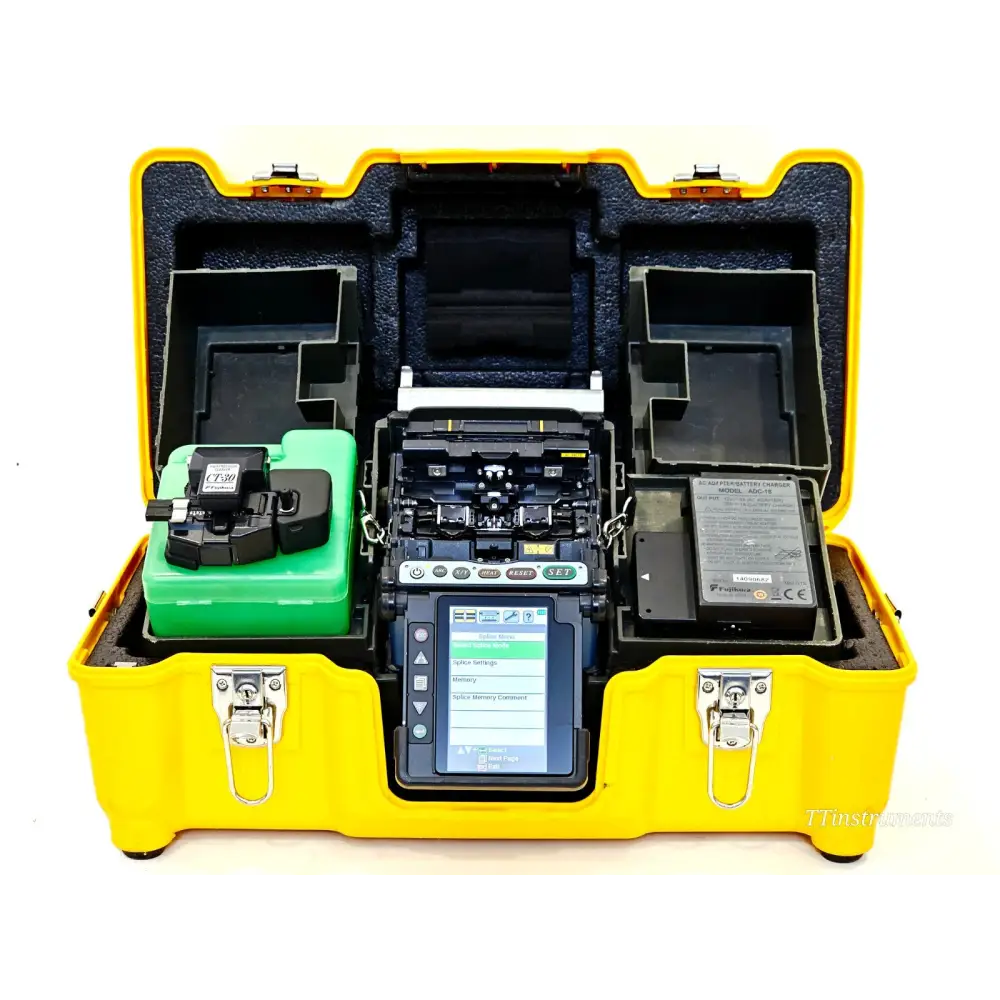Fujikura FSM-70S fusion splicer kit in open yellow carry case with CT-30 cleaver, battery, and AC adapter