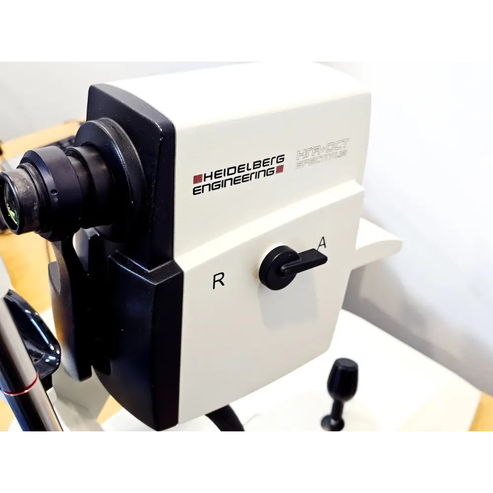 Heidelberg Engineering HRA+OCT Spectralis camera body close-up showing Heidelberg Engineering branding, R/A selector switch and objective lens port