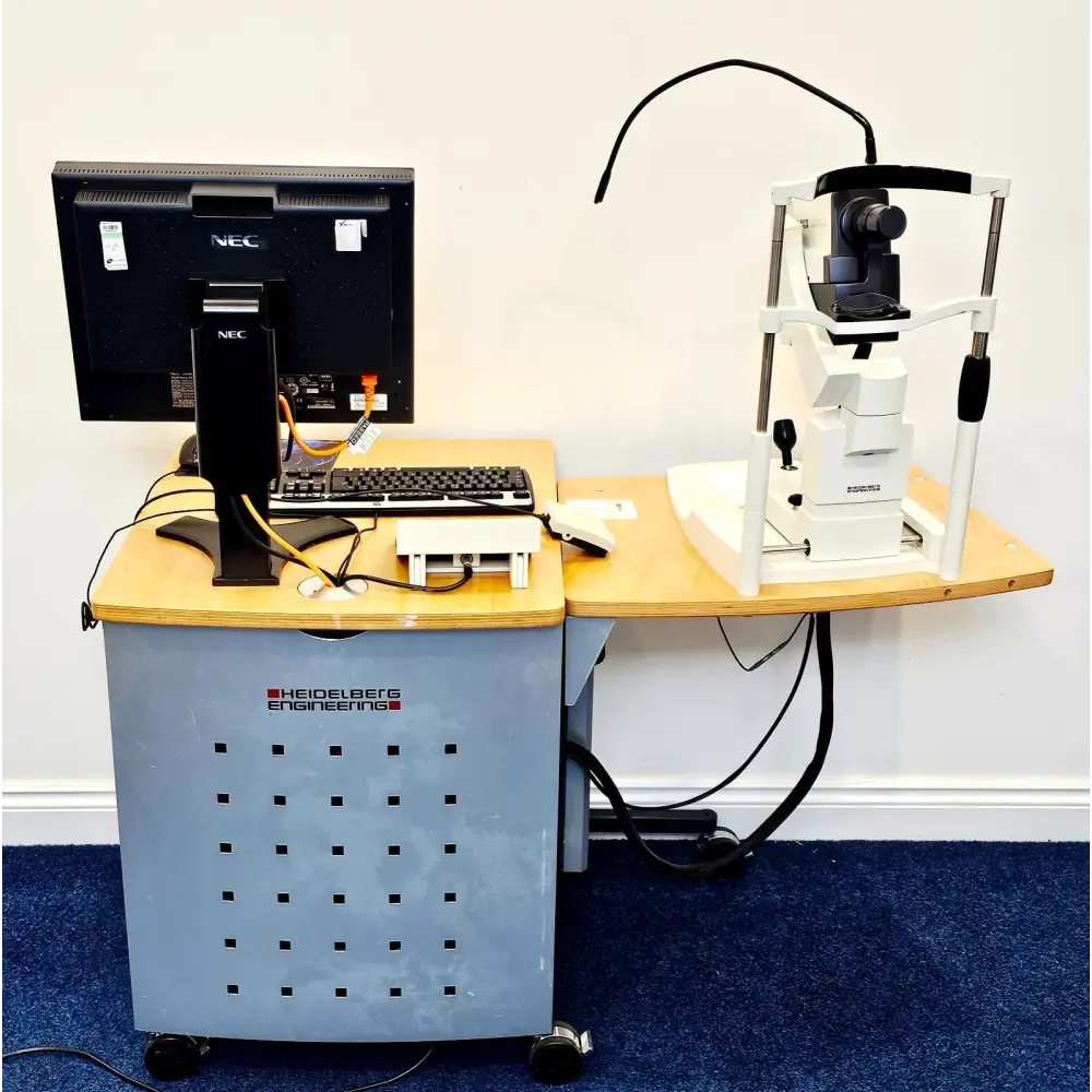 Heidelberg Engineering HRA+OCT Spectralis rear view showing NEC monitor, keyboard, Heidelberg branded trolley cabinet and camera on instrument table