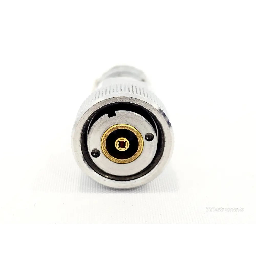 HP Agilent 909A APC-7 coaxial termination end-on view showing gold-plated precision 7mm APC-7 centre conductor and connector face