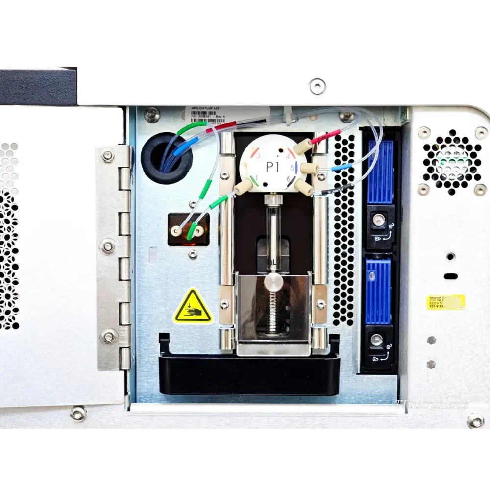Illumina MiniSeq SY-420-1001 internal fluidics compartment open showing P1 Merlion pump assembly, syringe drive, and fluid lines