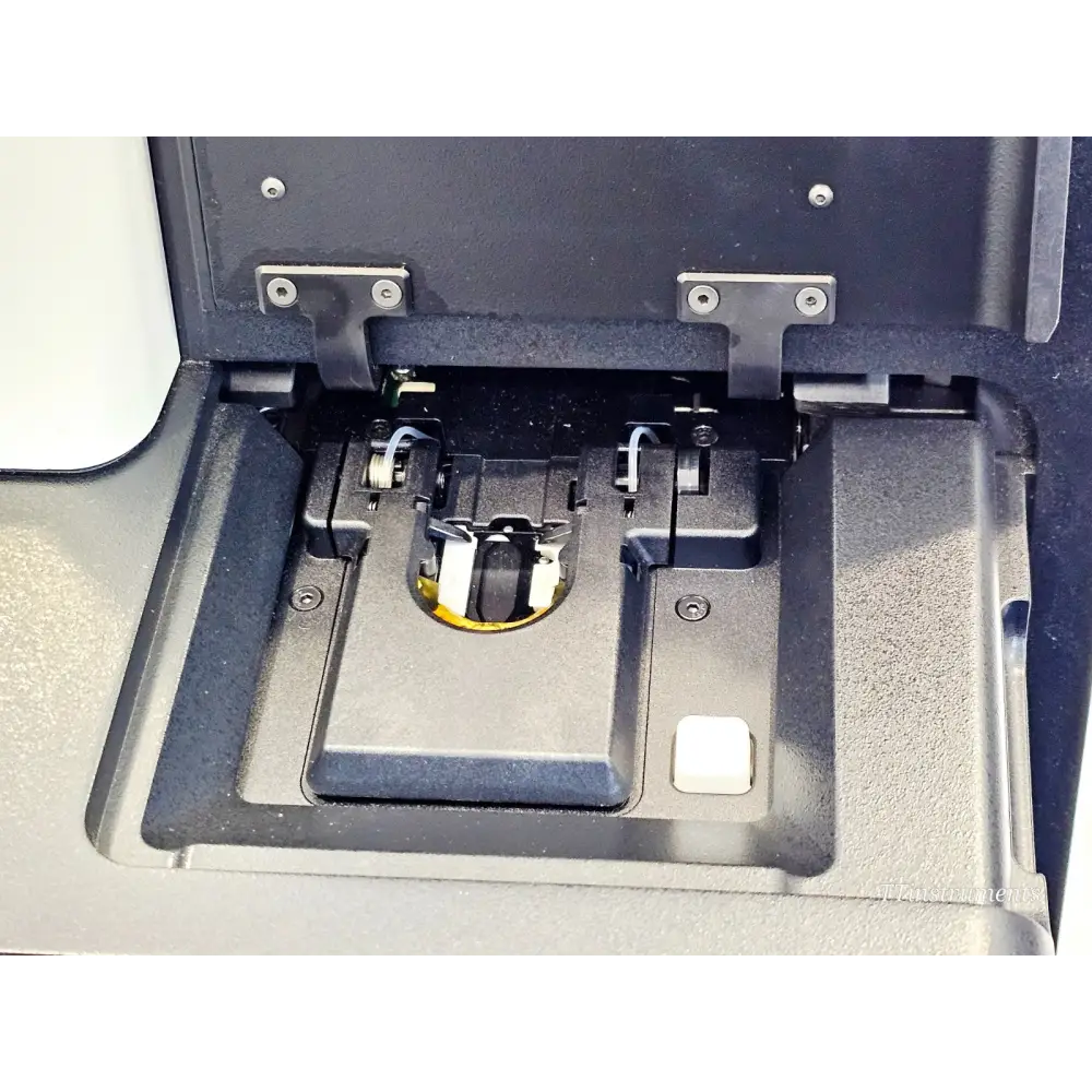Illumina MiniSeq SY-420-1001 flow cell compartment open showing flow cell stage, optical assembly, and registration mechanism