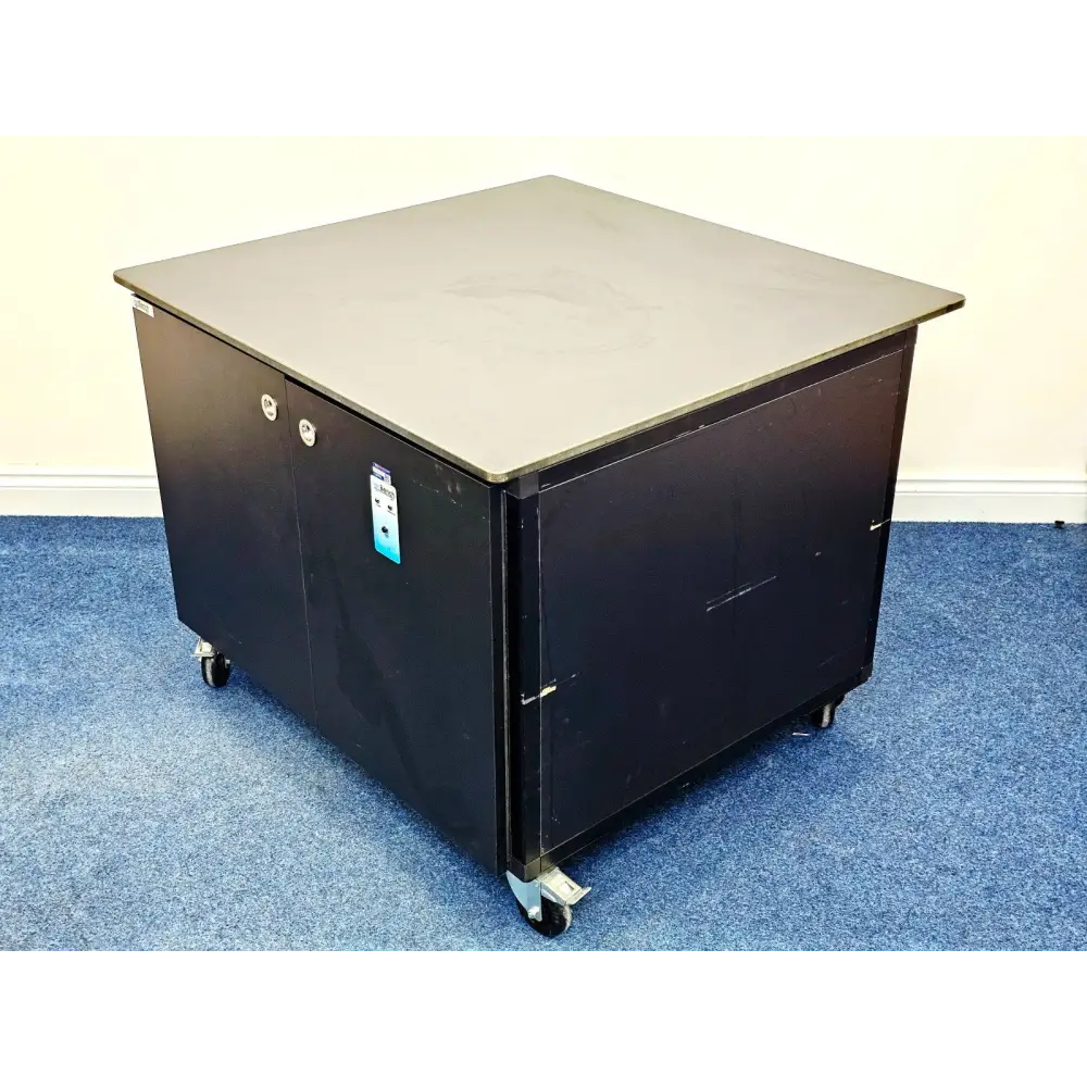 ionBench BCH120NE78 mobile lab bench angled front-corner view, large grey worktop, double-door black cabinet on 4 castors