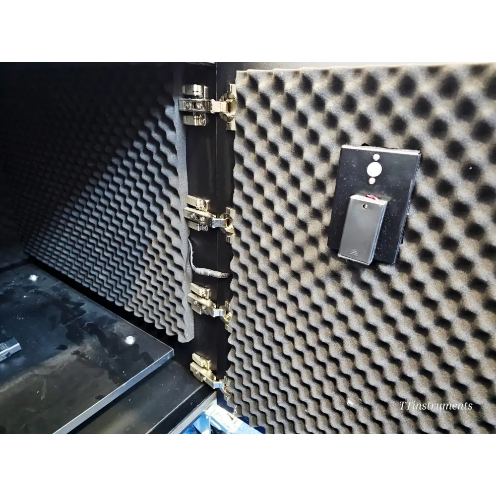 ionBench BCH120NE78 interior close-up of acoustic foam door lining, heavy-duty hinges, and internal power switch module