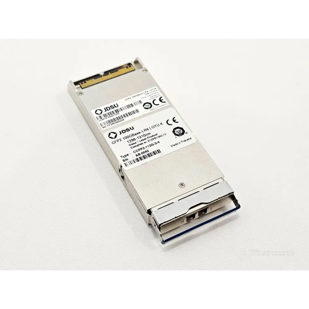 JDSU CCFP2-112G-3-4 CFP2 100G LR4 OTU4 transceiver top view showing labels, SN AB-0042, CE marking