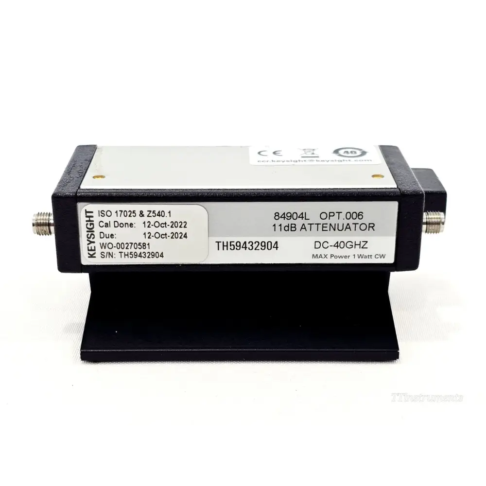 Keysight 84904L Opt. 006 11dB attenuator front view showing calibration label, S/N TH59432904, DC-40GHz, on black stand