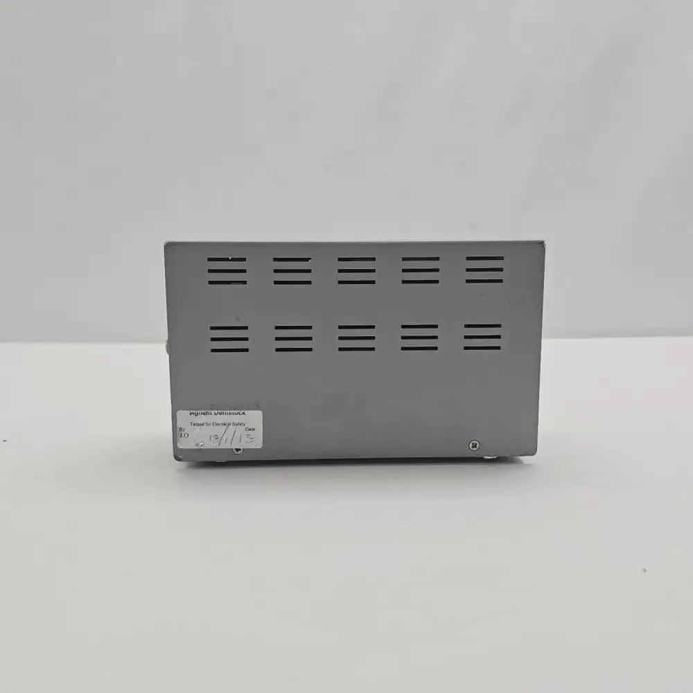 Agilent N2779A Power Supply bottom panel view showing Agilent Demostock electrical safety tested sticker dated 18/11/13