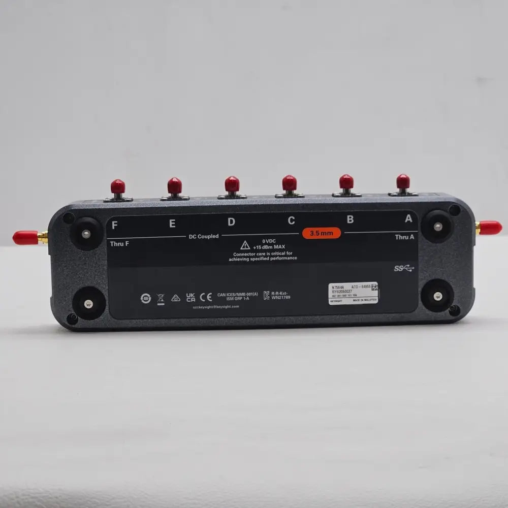 Keysight N7564A ECal Module bottom view showing ports F–A, 3.5 mm orange label, serial number and regulatory markings