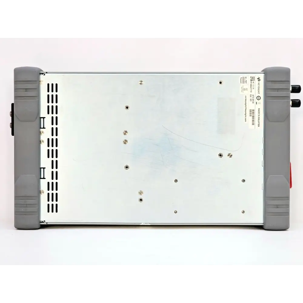 Keysight N7751A base showing Keysight serial number label, Made in Malaysia marking, ventilation slots and screw fixings