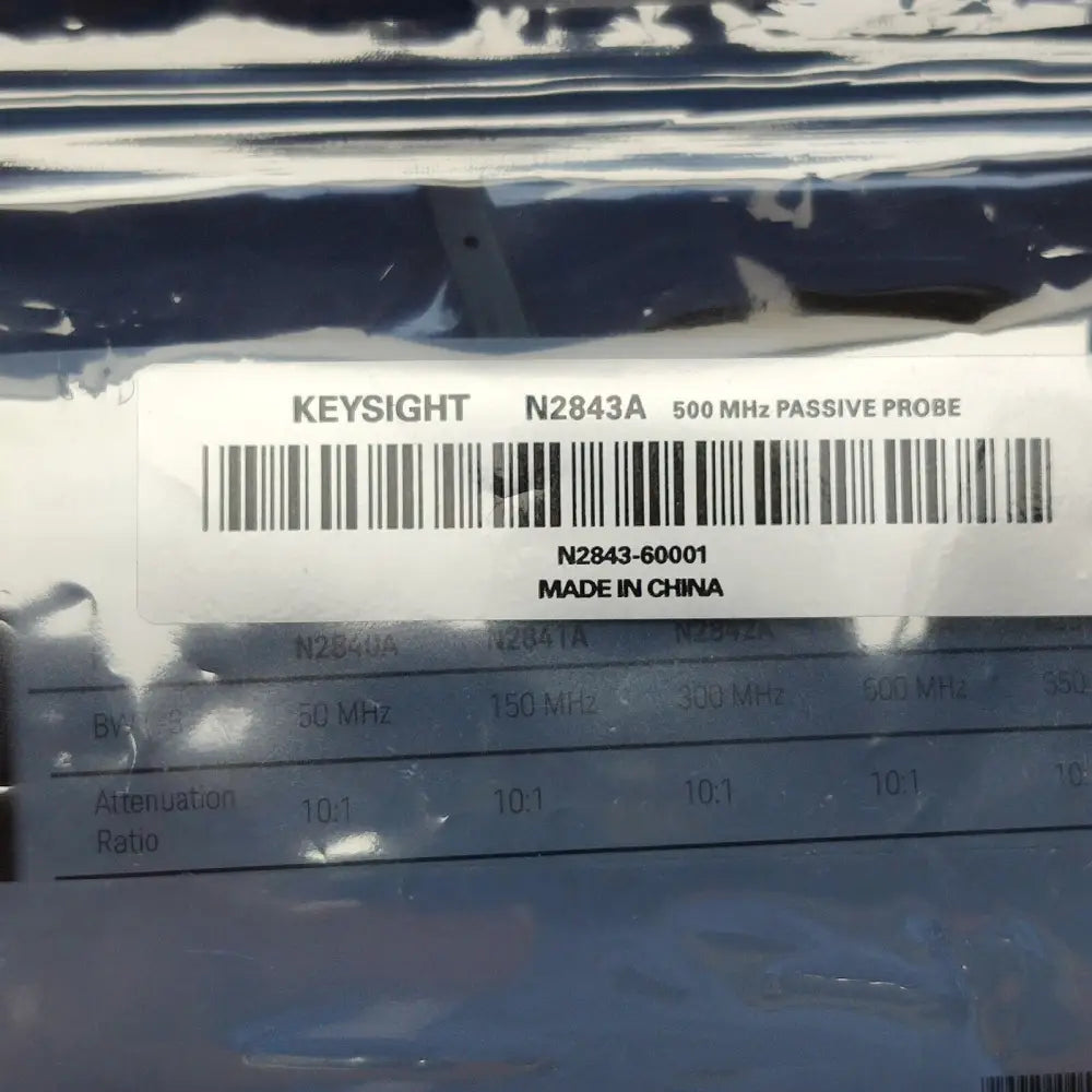 Keysight N2843A probe bag label showing 500 MHz bandwidth, 10:1 attenuation ratio spec comparison chart