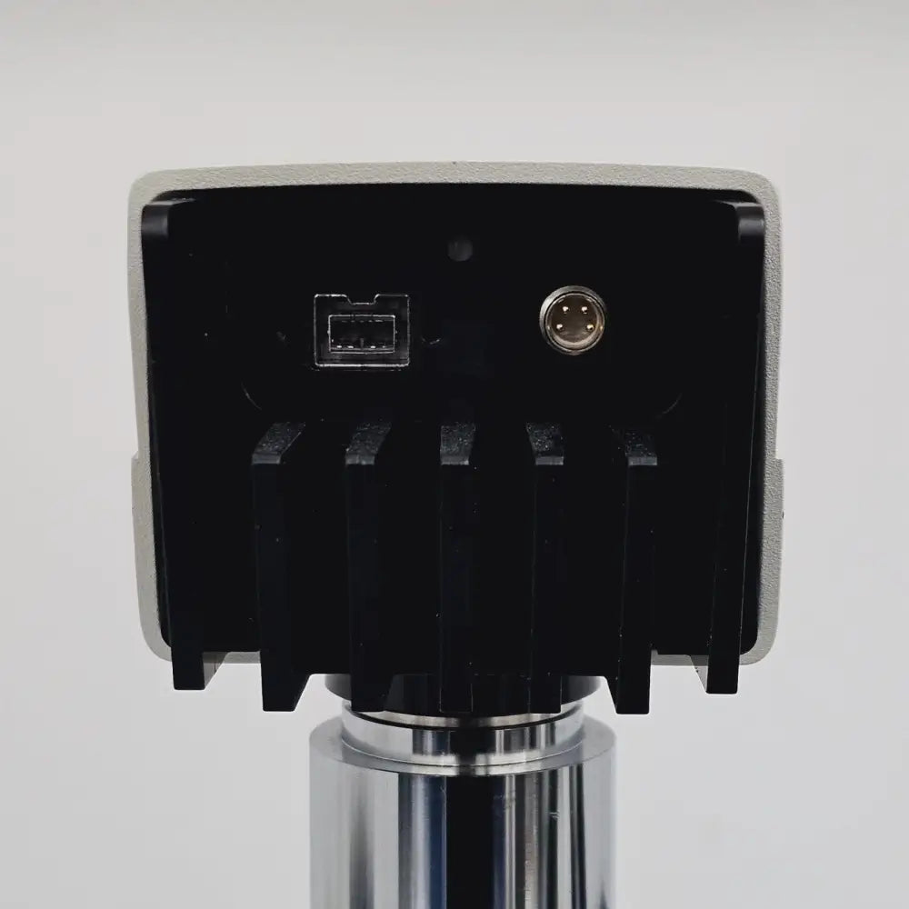 Leica DFC310 FX cooled fluorescence camera close-up showing FireWire connector and body