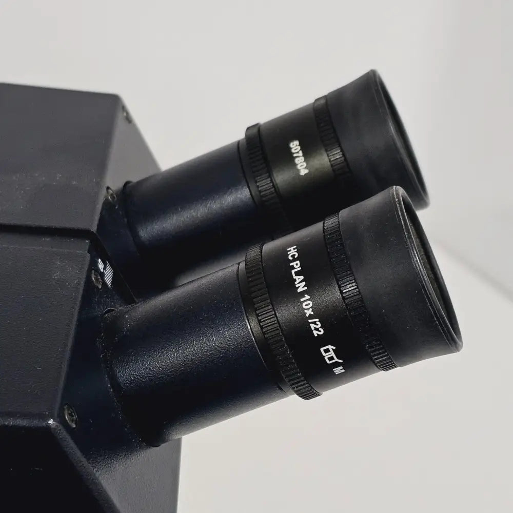 Leica HC Plan 10x/22 M microscope eyepiece 507804, 30mm barrel, front view showing engraved specification markings
