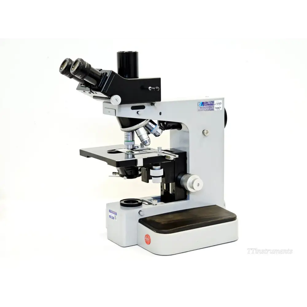 Leitz Orthoplan compound microscope left-side view showing binocular head, objective turret, sub-stage condenser and Leitz logo