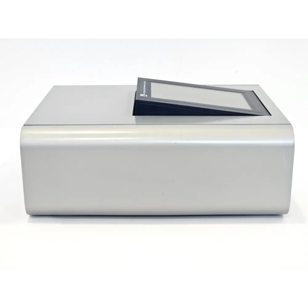 Lonza 4D-Nucleofector Core Unit left-side view with touchscreen tilted open, minor surface marks visible on housing