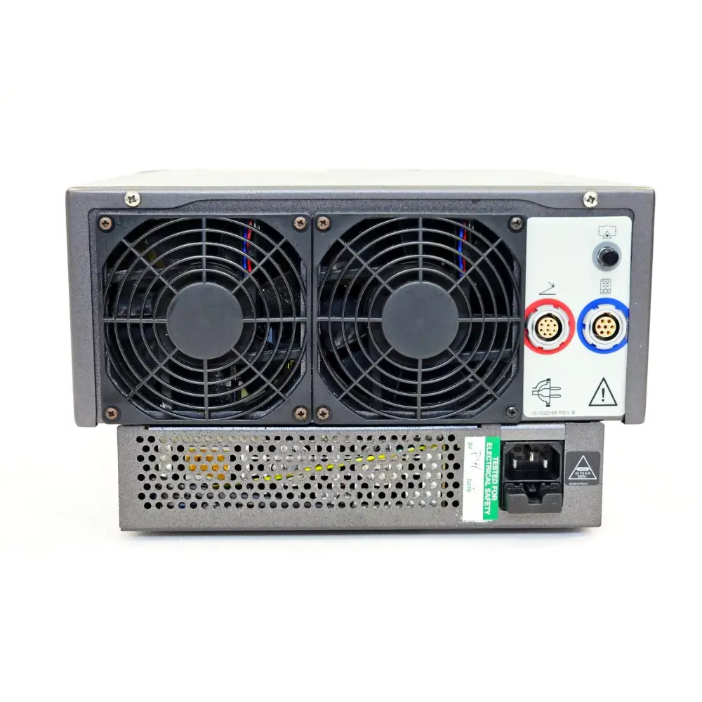 Lumenis Novus Spectra rear panel showing dual cooling fans, delivery device connectors, mains IEC inlet and electrical safety label