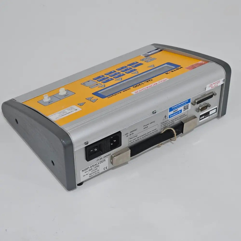 Metron QA-1290 top view showing compact portable enclosure and keypad layout