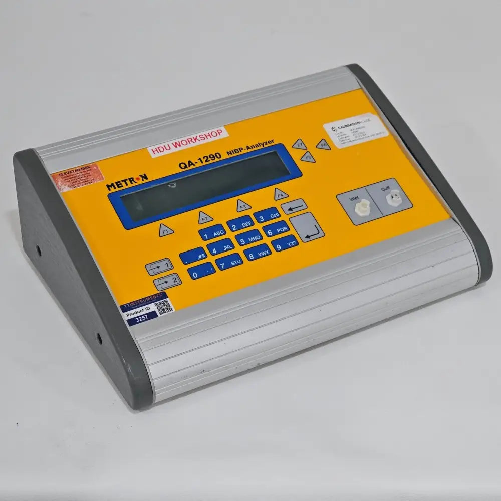 Metron QA-1290 NIBP Analyzer right side profile showing ports and connectors