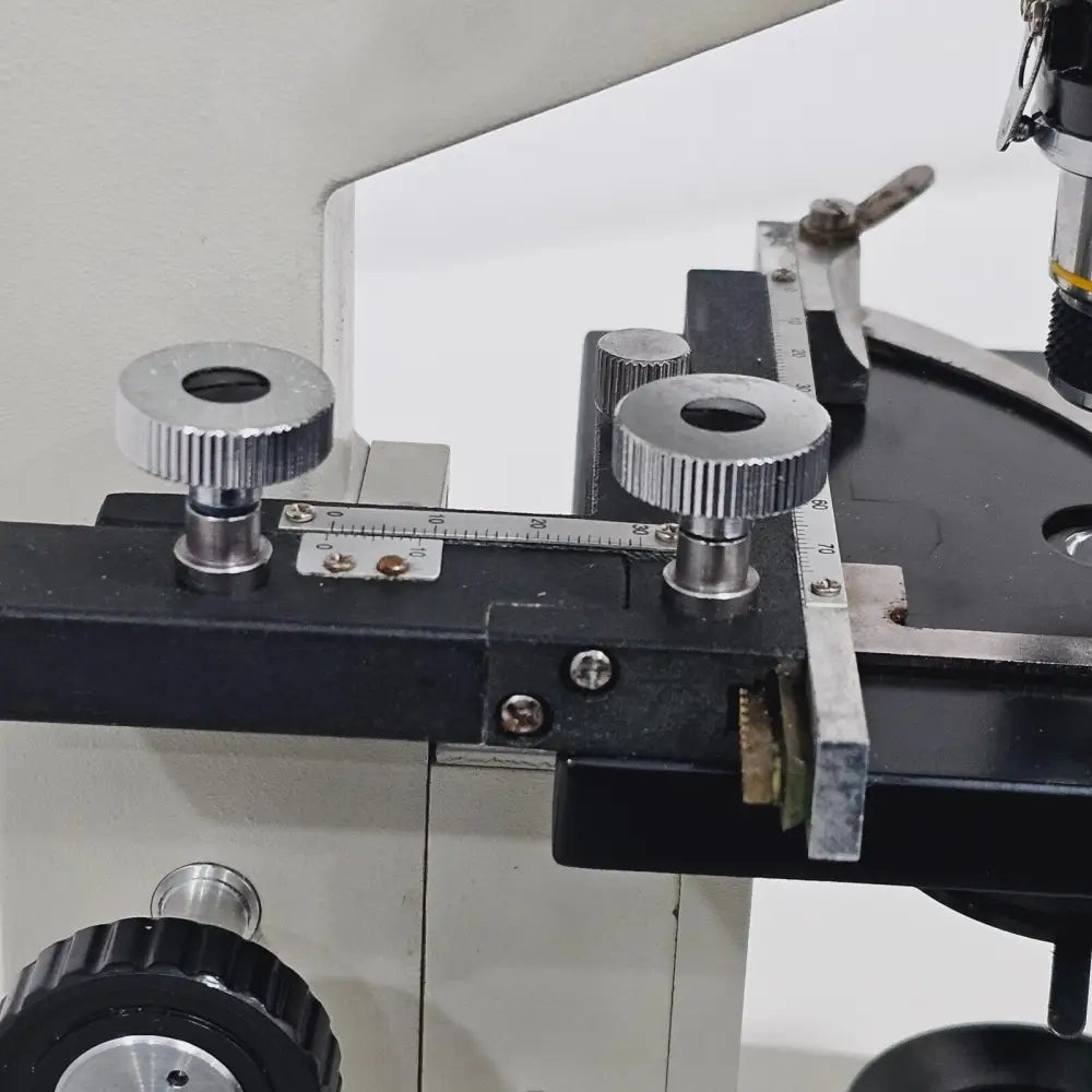 Close-up of 40/0.65 achromatic objective lens on rotating nosepiece of compound microscope