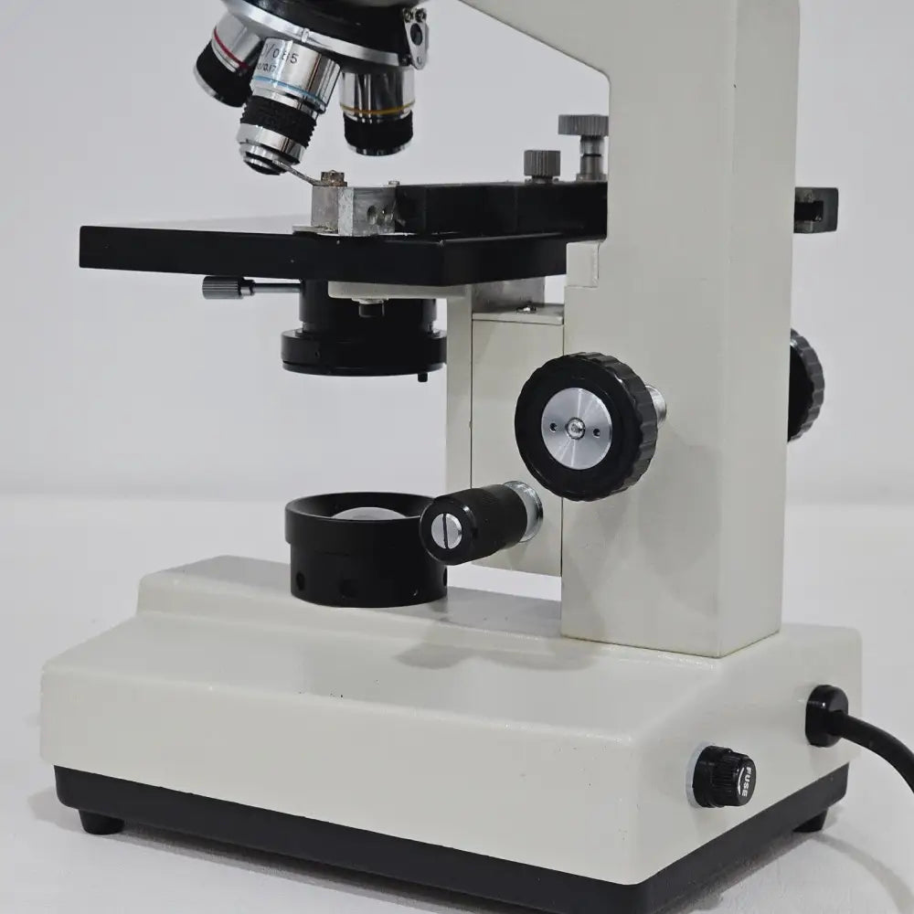 Base and illumination switch of compound biological microscope on laboratory bench