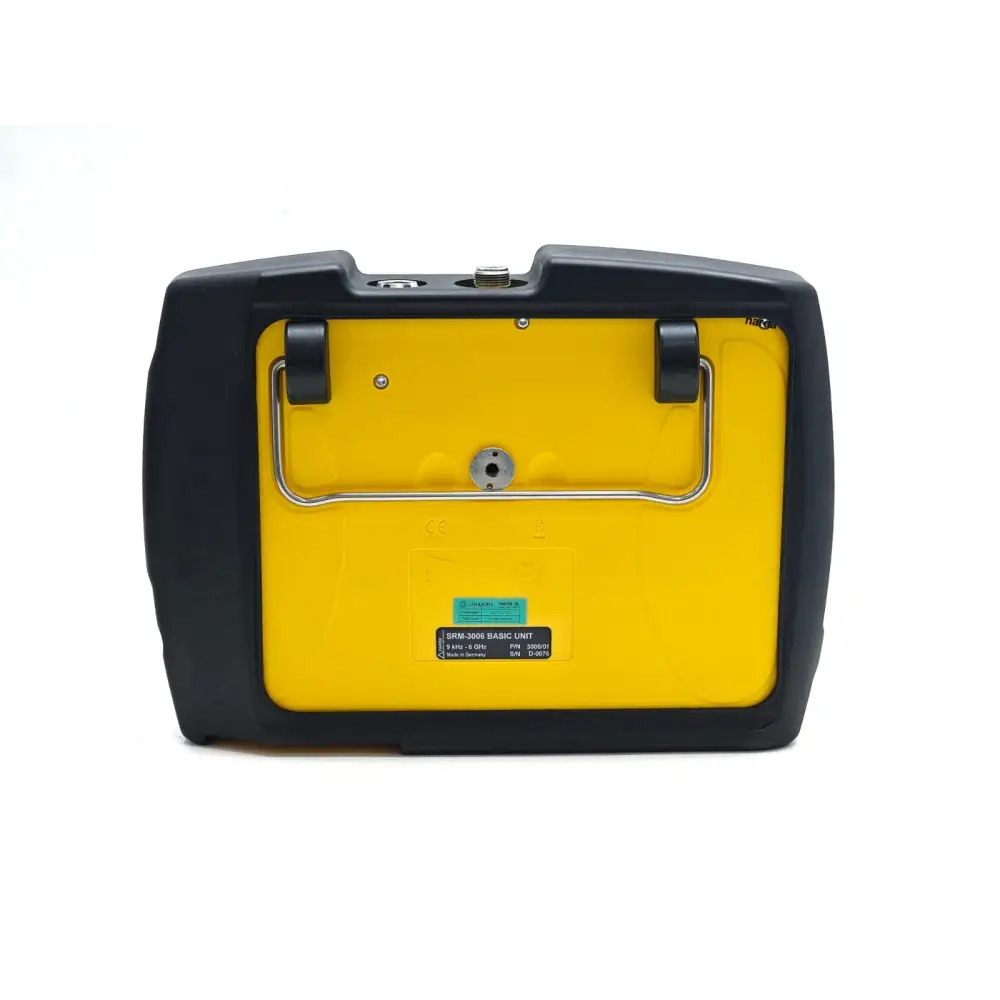 Narda SRM-3006 rear panel showing yellow body, serial number label D-0076 and tripod mount